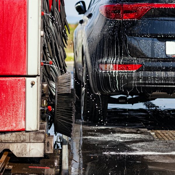 Black car in automatic car wash